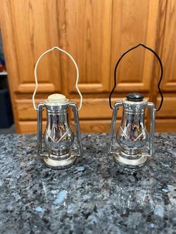 Vintage Plastic Silver color Hanging Lantern Pair of Salt and Pepper Shakers.  Size approximately 3 inches tall, with handle 5 inches tall.  Preowned.