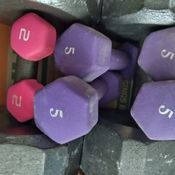 FOUR FIVE POUND AND TWO TWO POUND DUMBBELLS.
