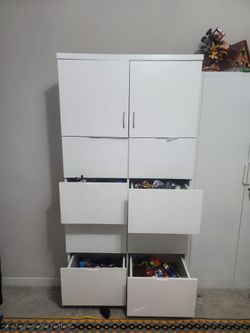 tall, multi-compartment white cabinets or wardrobestall, multi-compartment white cabinets or wardrobes