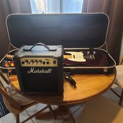 2009, Fender Telecaster guitar in Midnight Wine with Marshall mini Amp