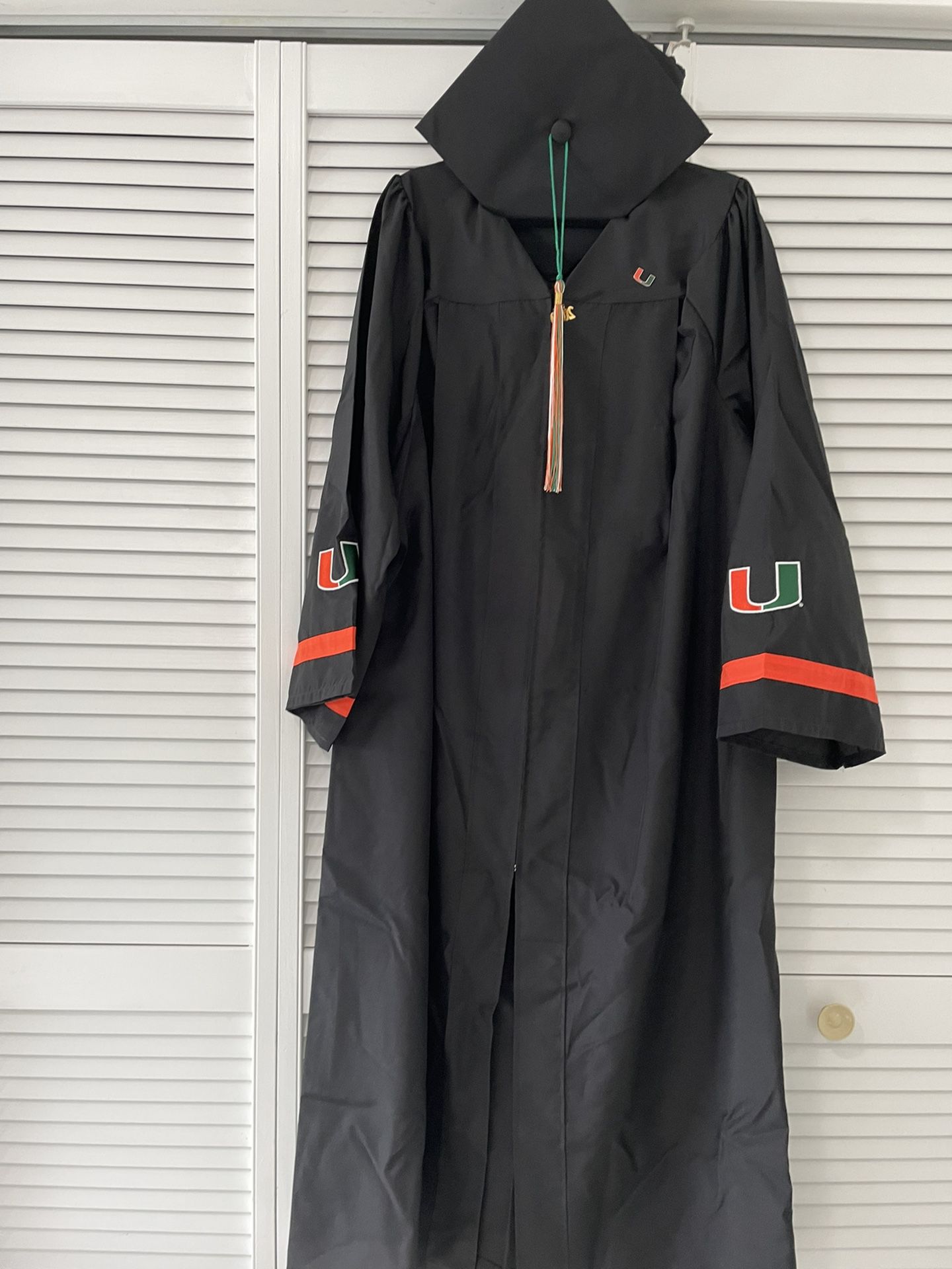 UM University Of Miami  graduation cap gown and tassel