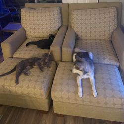 Two Chairs With Ottomans 