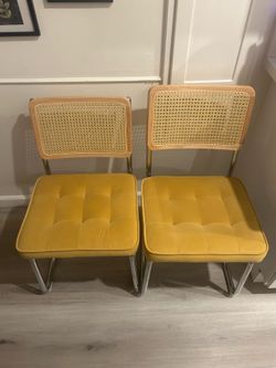 Two mustard yellow velvet mid-century chairs