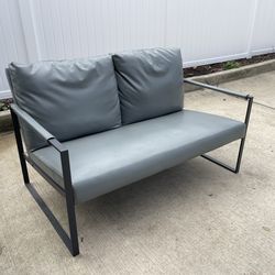 Grey leather office sitting couch