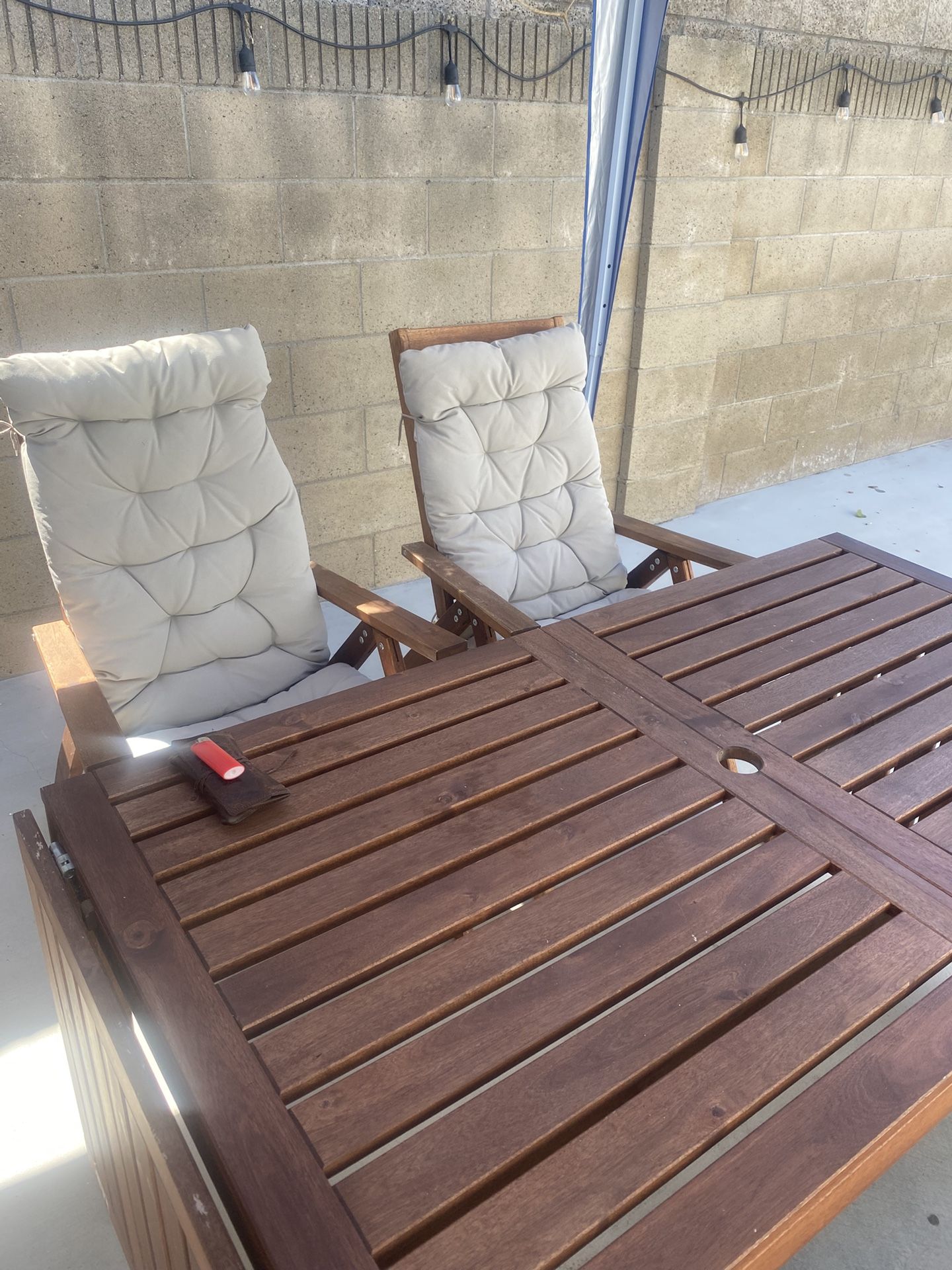 outdoor table in cherry wood composed of four cherry wood chairs with fabric chair covers (washable) and wooden center table umbrella.