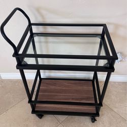 Rolling bar cart with glass top