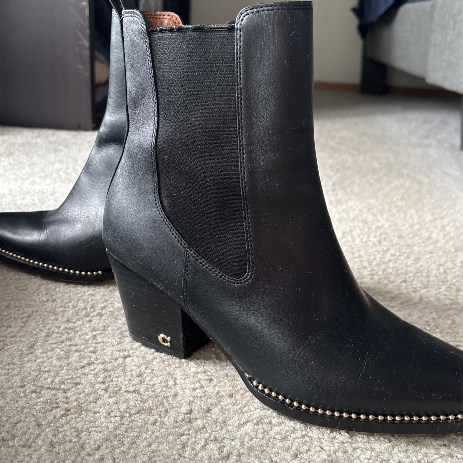 Coach Pierce, black, gold accents pull on boots. Heel Is 2.25”