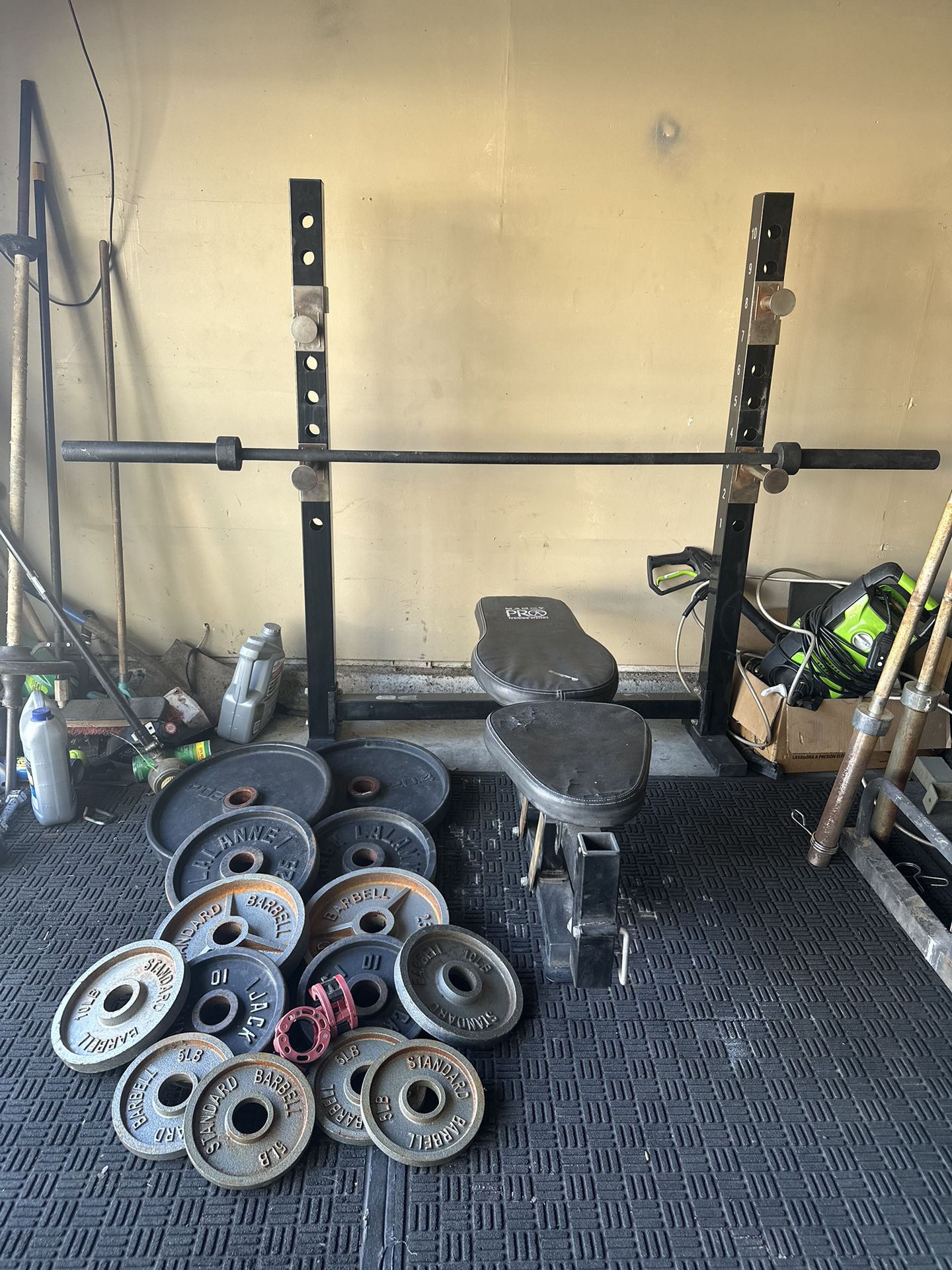 Bench press/ squat rack with 7ft 45lbs bar with 250lbs of Olympic weights plus curl bar