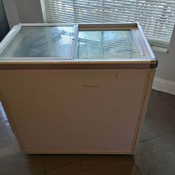 Slide top freezer