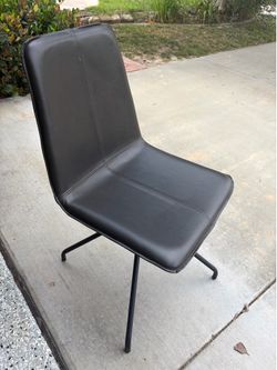 Swivel, brown leather chair
