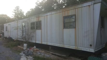 Single wide trailer 2 bedroom 1 bath needs to be remodeled floors are good walls are good roof is good windows need replaced