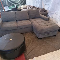 Grey couch with storage and pullout bed good condition cleaned we sell all the time delivery $40 local