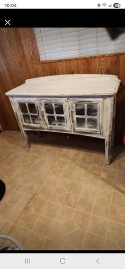 Distressed wooden cabinet with doors..used - good.