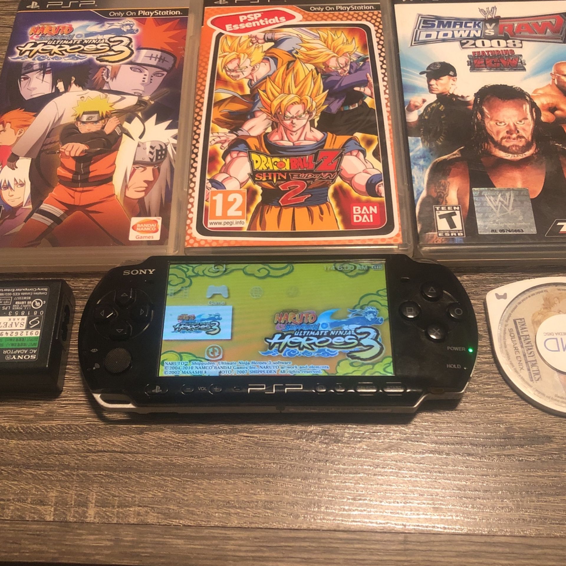 Sony PSP-3000, Naruto Ultimate Ninja Heroes 3, Dragon-ball Z Shin Budokai 2,  Assassin’s Creed Bloodline, WWE SmackDown Vs Raw 2008, NFL Street 2 & FF