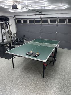 Kettler Full-sized (9’ x 5’) ping pong table, kept garaged, set of paddles and balls, everything included, in Great Used Condition.