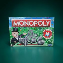 Monopoly Board Game for Ages 8+ Includes 8 Tokens 2-6 Players New Factory Sealed. This image shows the Hasbro Gaming Monopoly board game, which is a f