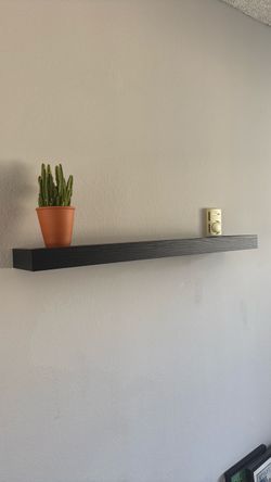 Very sturdy hanging wall shelf. Simple. Black.