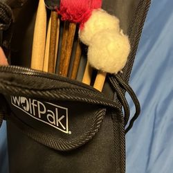 Wolfpak Percussion Case w/ percussion drum sticks and mallets.