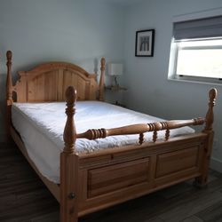 Solid wood bed frame with matching footboard + clean mattress