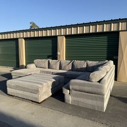 Luxurious Platinum Haze Corduroy U-Sectional w/ Oversized Ottoman - Free Delivery