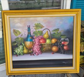 Beautiful still life fruit and wine painting in golden frame.  In excellent condition. 
25.5  X  28.5