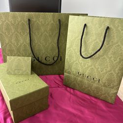 4 pieces of Gucci paper products.  x l shopping bag, large shopping bag, shoe box and card