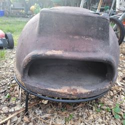 Terracotta clay pizza oven with metal stand