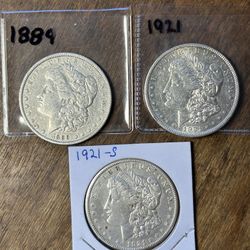Three Morgan Silver Dollars. Group 28.