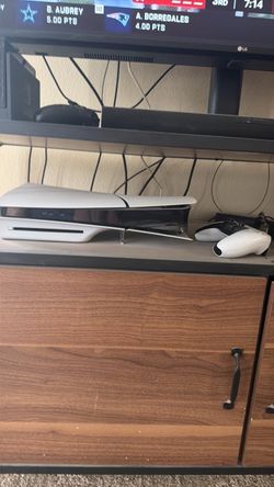 PlayStation 5 Console with controller.