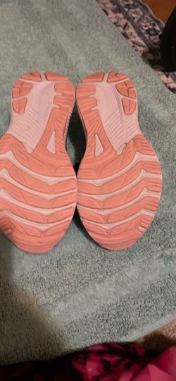 Pink Running Sneakers These shoes are the women's ASICS GT-2000 14 running shoes, specifically in the "Rubble Red/Vivid Coral" size 8