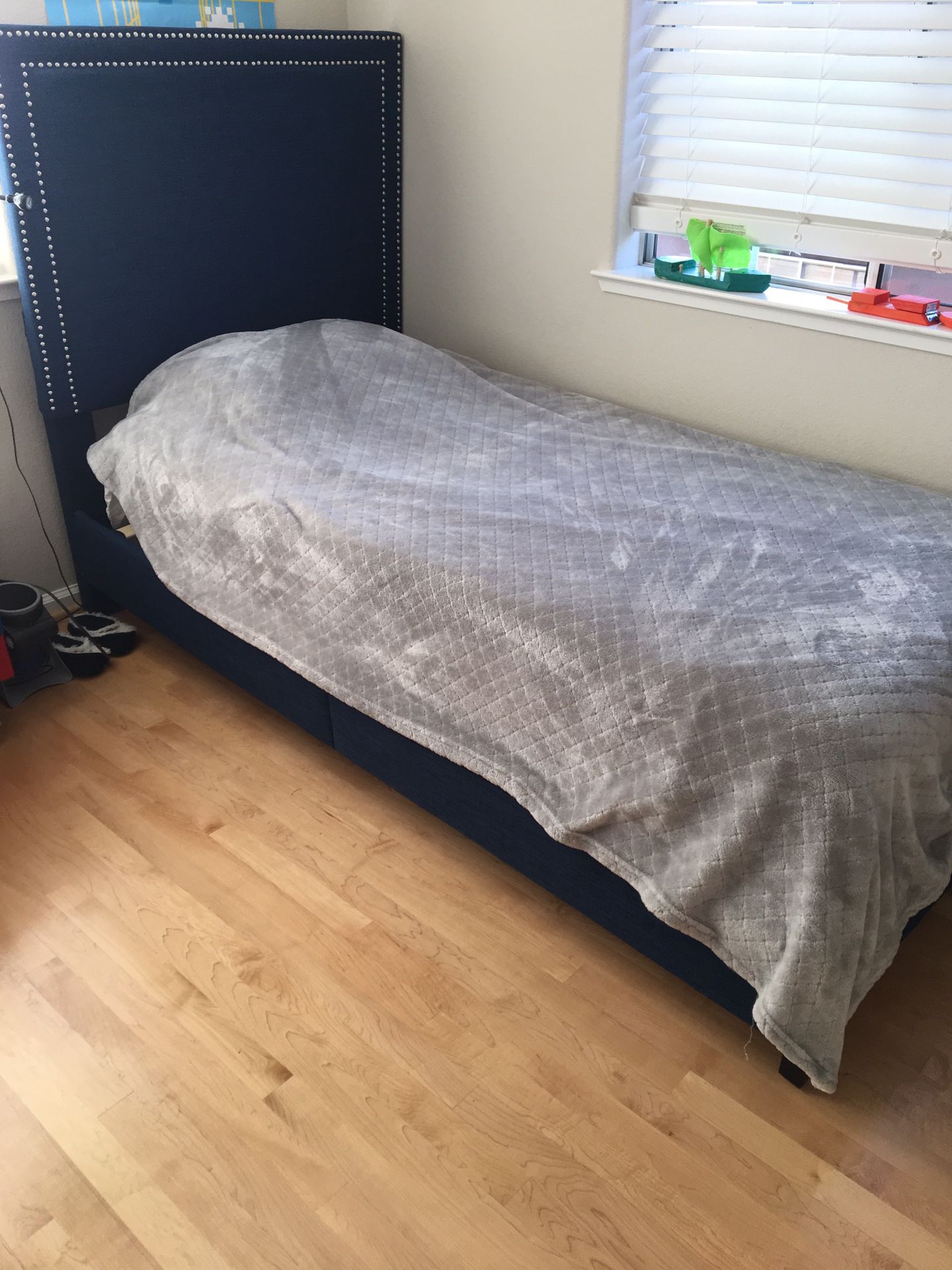 Blue fabric twin bed frame (no mattress)
