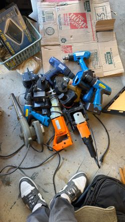 A Bunch Of Power Tools With Batteries