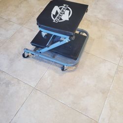 Adjustable creeper seat with wheels, like new