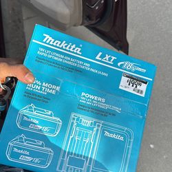 2 Makita batteries and a rapid charger