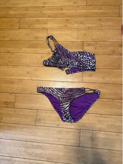 BECCA purple animal print bathing suit one shoulder with side chains. Size medium