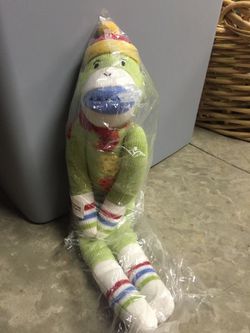 Brand new green sock monkey stuffed animal