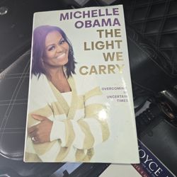 The Light We Carry: Overcoming in Uncertain Times" by Michelle Obama. 