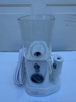 New Waterpik, a well-known American brand portable water flosser with original travel case