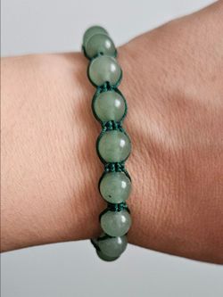 Green Macrame braceletHandmade 
Macrame 
Light Green beads
Dark green macrame thread
As tight as 6.1"
As loose as 10.06"