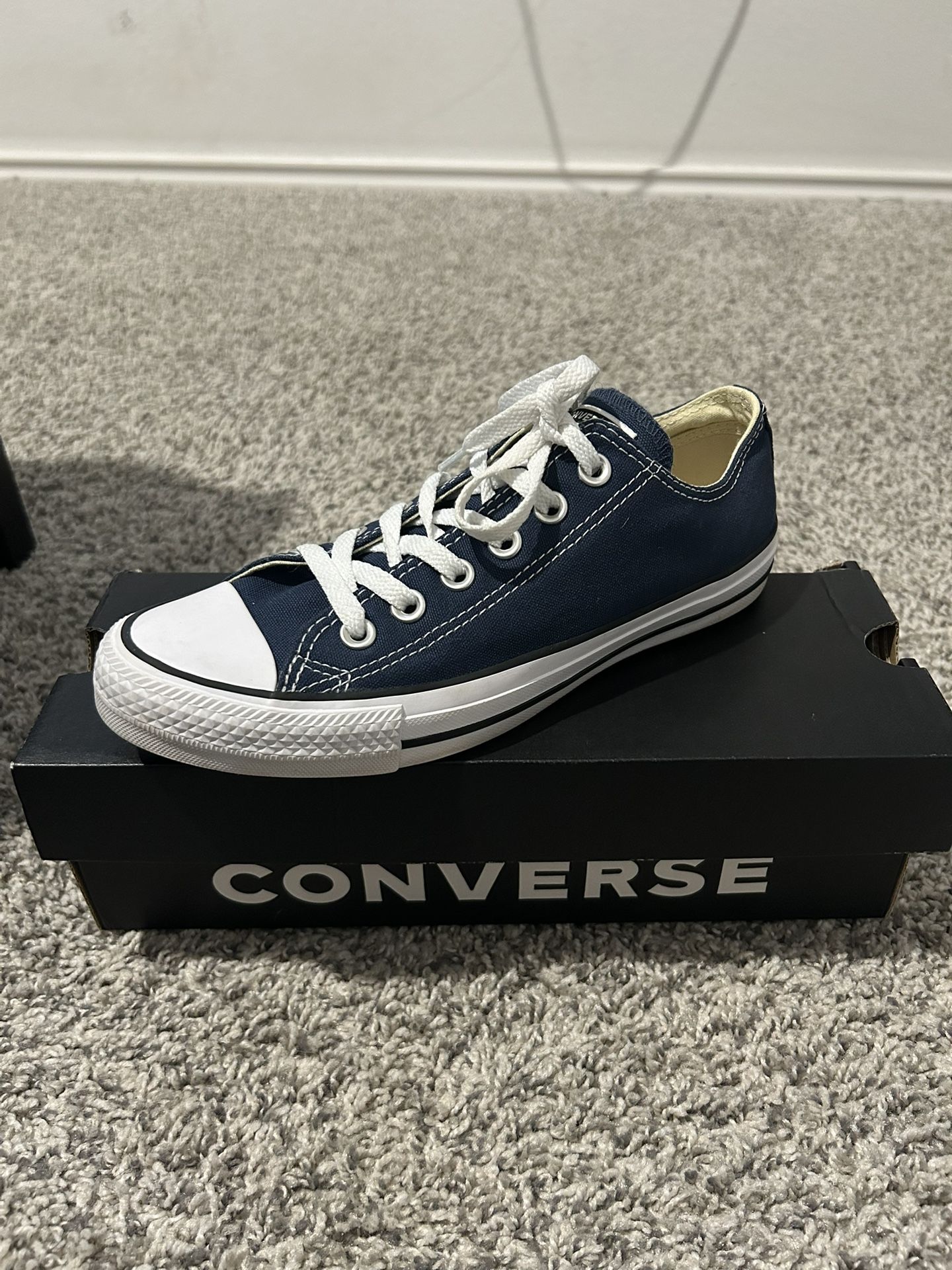 navy blue low converse 
