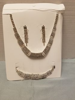 Sparkling silver-tone necklace, bracelet and matching earrings.