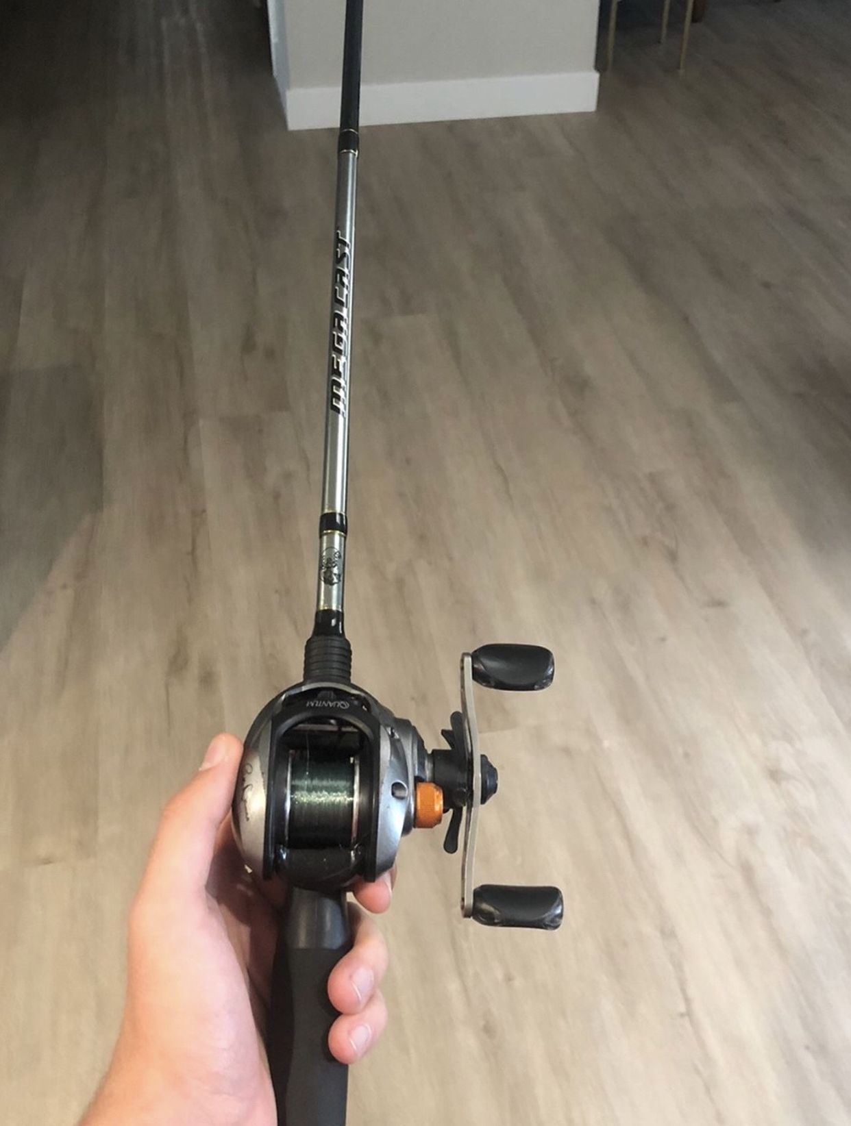 Fishing baitcaster combo w/ hooks, lures, and plastics