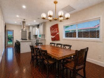 Custom Wood Plank Dining Table with six chairs.
