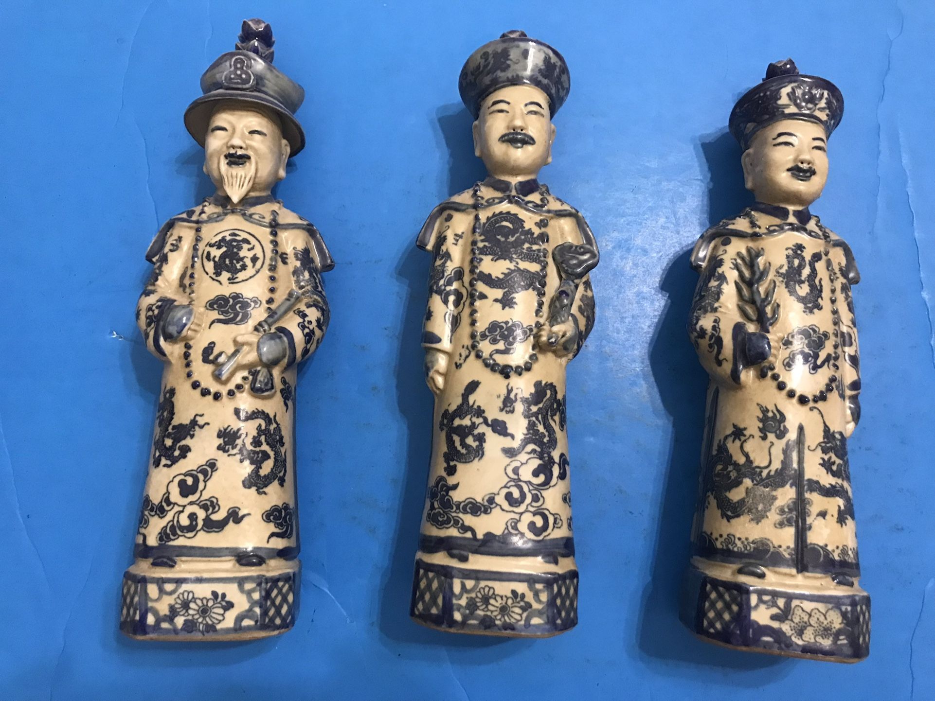 Set of Three Generations of Qing Dynasty Emperors Porcelain Figurines, signed