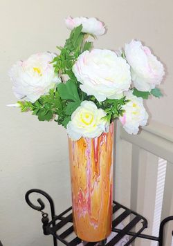 Silk flowers in painted vase