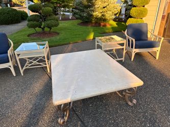 Chairs, side tables, and large coffee table set.