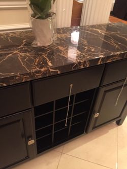 Buffet, wine rack, cabinet marble top cost four times more