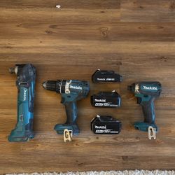 Makita Bundle. Impact Driver. Drill. Multi-tool. Two 4 Ah Batteries. One Two Ah Batteries