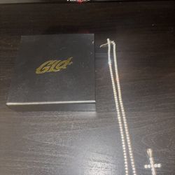 Dimond tennis chain and cross charm Gld