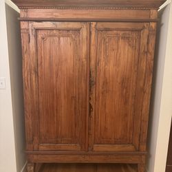 Large solid-wood armoire measuring 77" high, 56.5" wide, and 28.25" deep